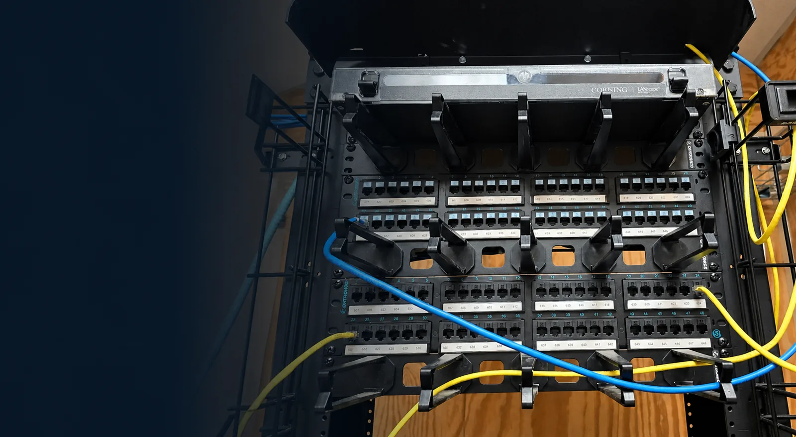 Commercial network rack showing copper patching and fiber components.