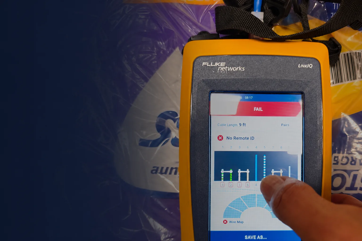 WiredOptics testing an Ethernet cable with a Fluke LinkIQ showing a failed wire-map result.