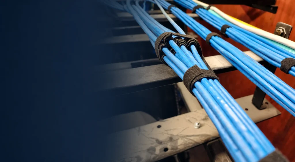 Real WiredOptics structured cabling bundled and secured with reusable cable-management straps.
